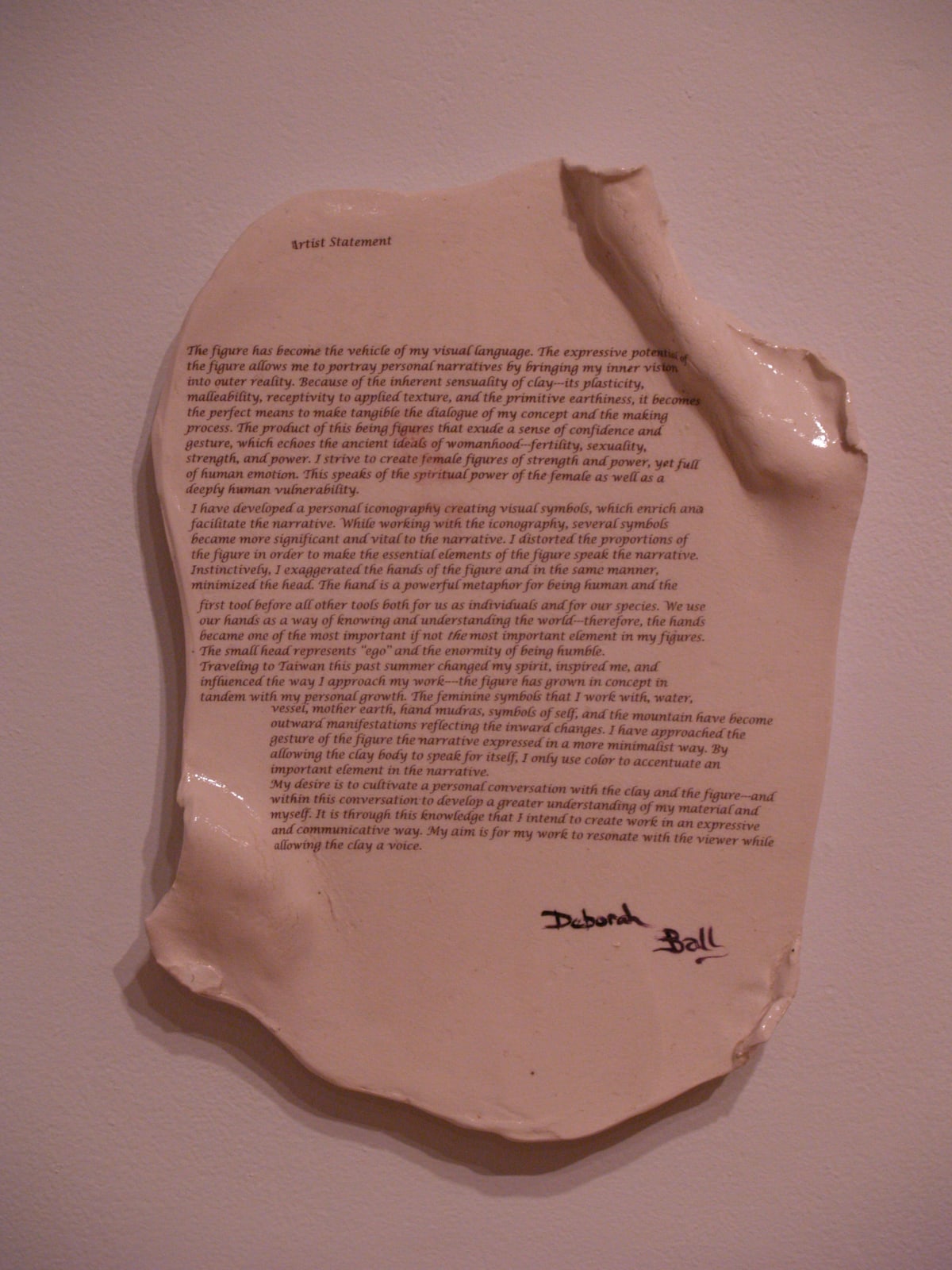 Deborah's artist statement printed on a hand-built ceramic scroll, its edges curling like paper, signed by her